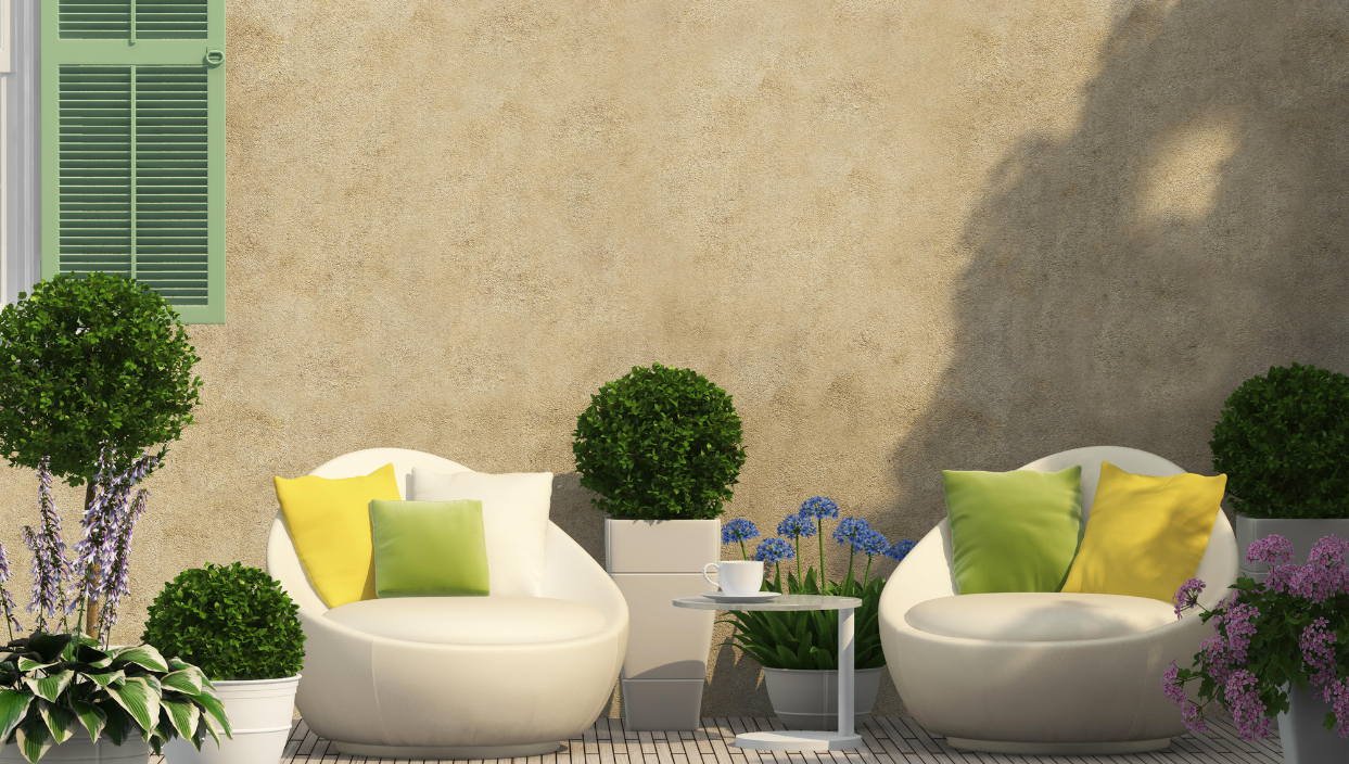 Photo of an outdoor setting featuring green, yellow, and white outdoor fabrics